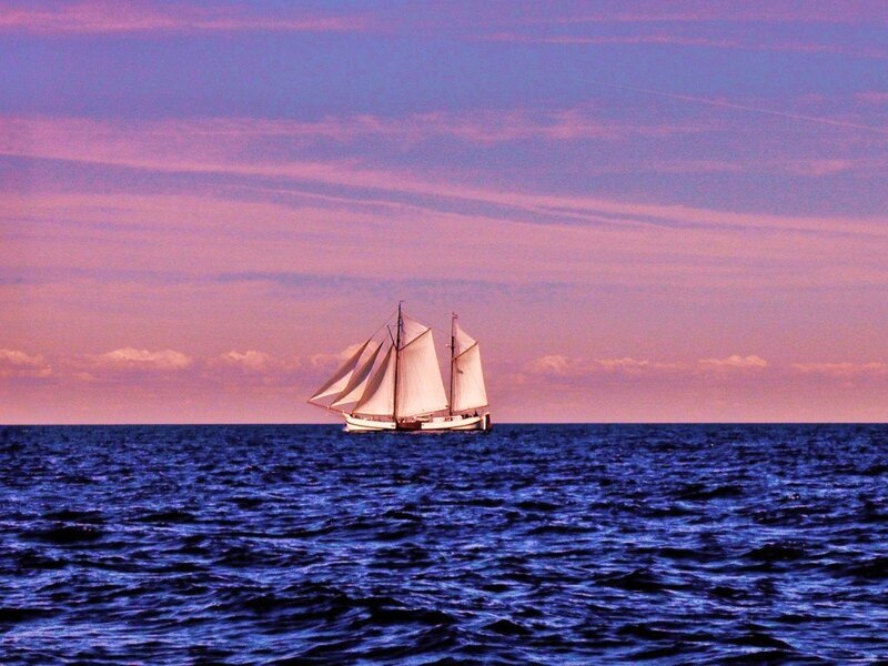Sailboat at sunset on the ocean