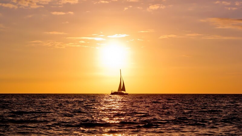 sailboat at sunset on the ocean