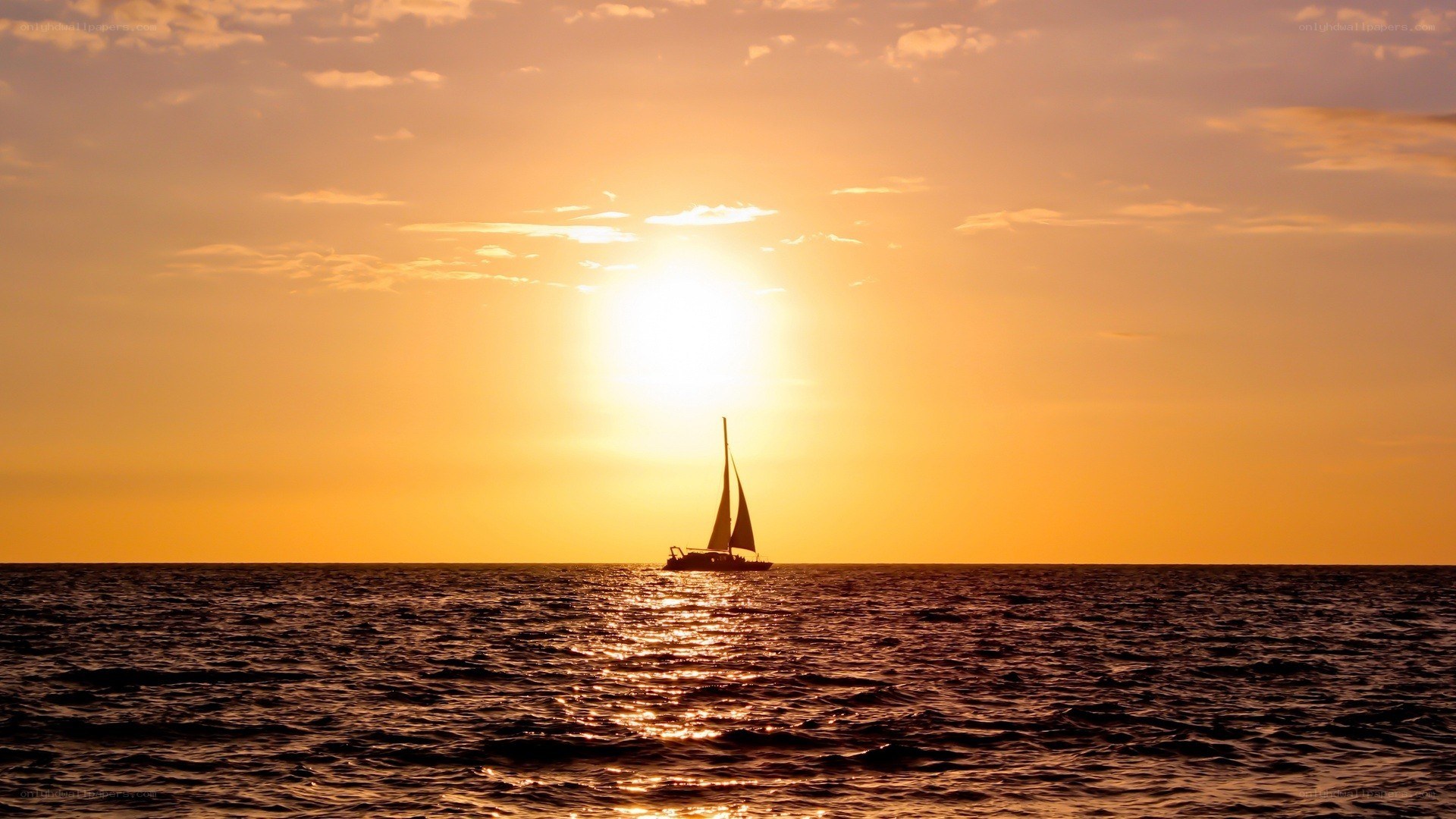 sailboat at sunset on the ocean
