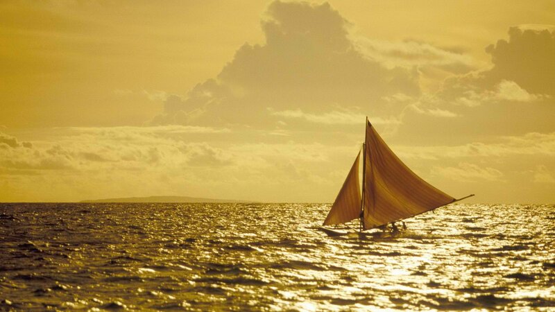 Sailboat at sunset on the ocean