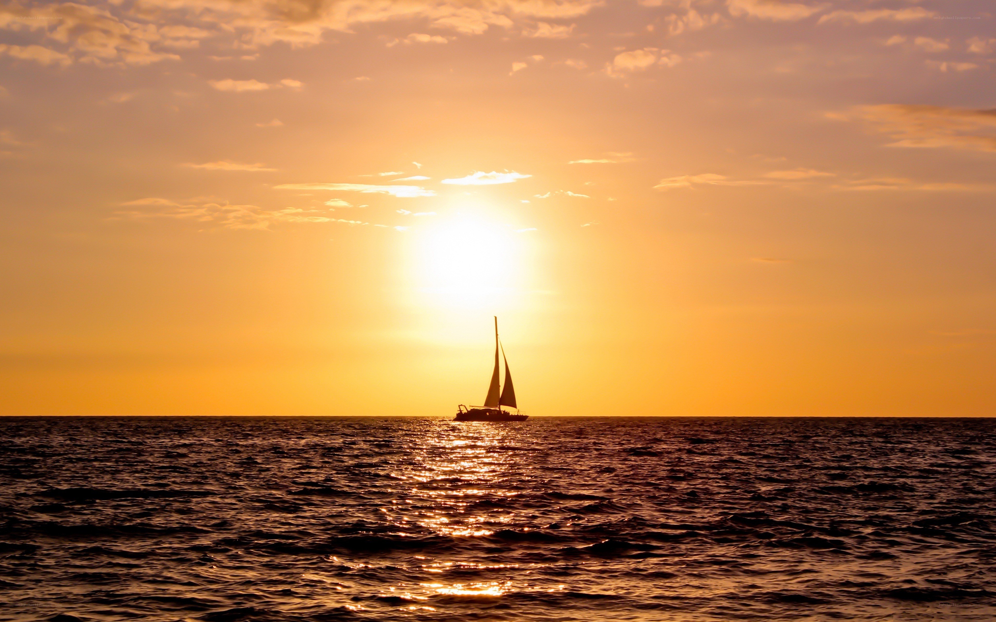 sailboat at sunset on the ocean
