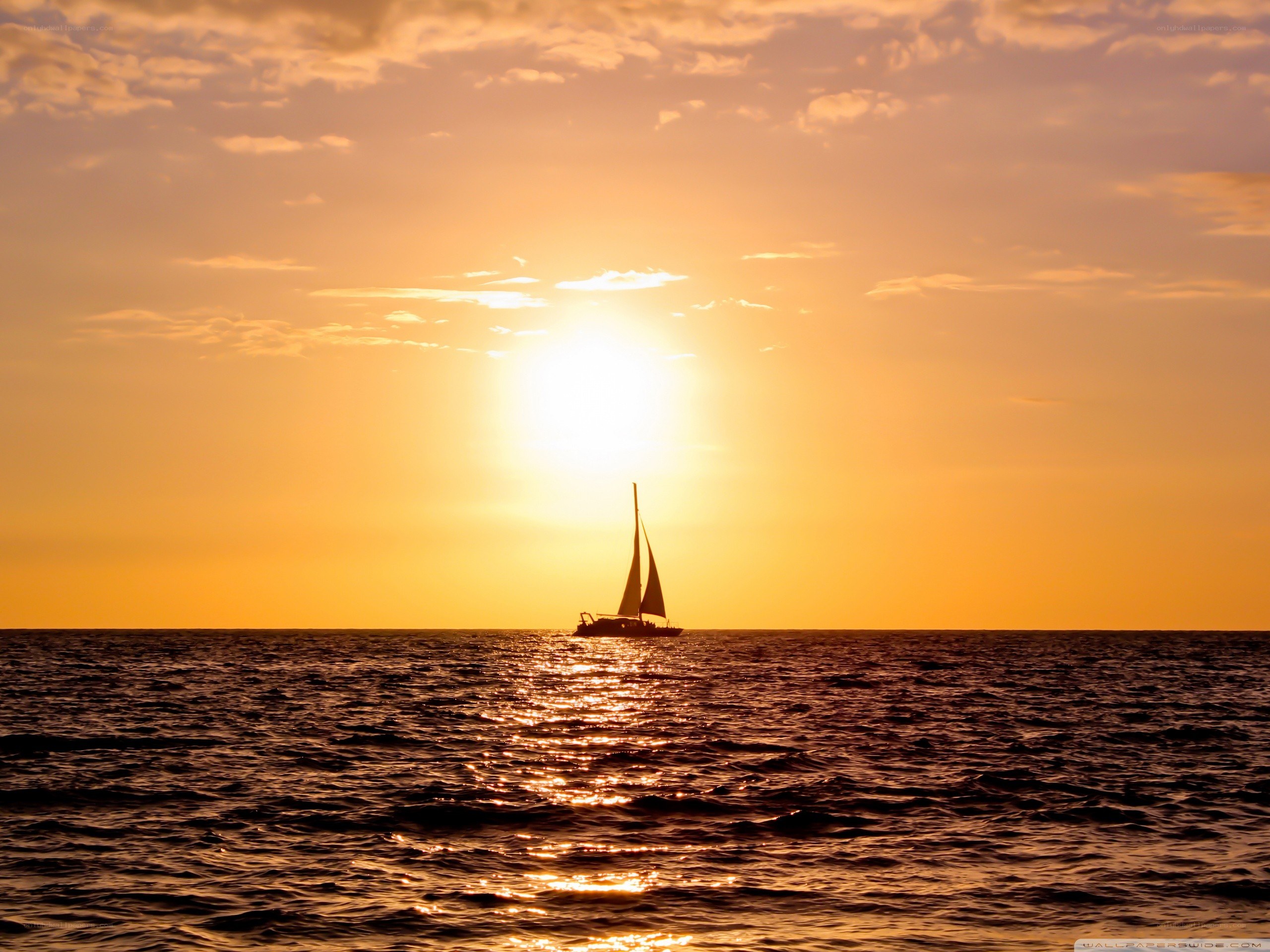sailboat at sunset on the ocean