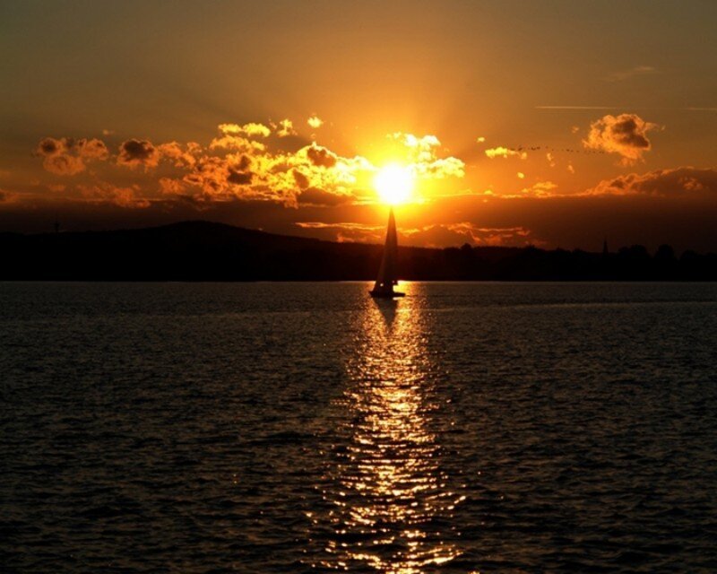 sailboat at sunset on the water