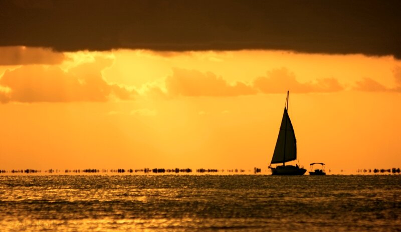 Sailboat at Sunset — Orange, Dramatic, Photograph, Motorboat