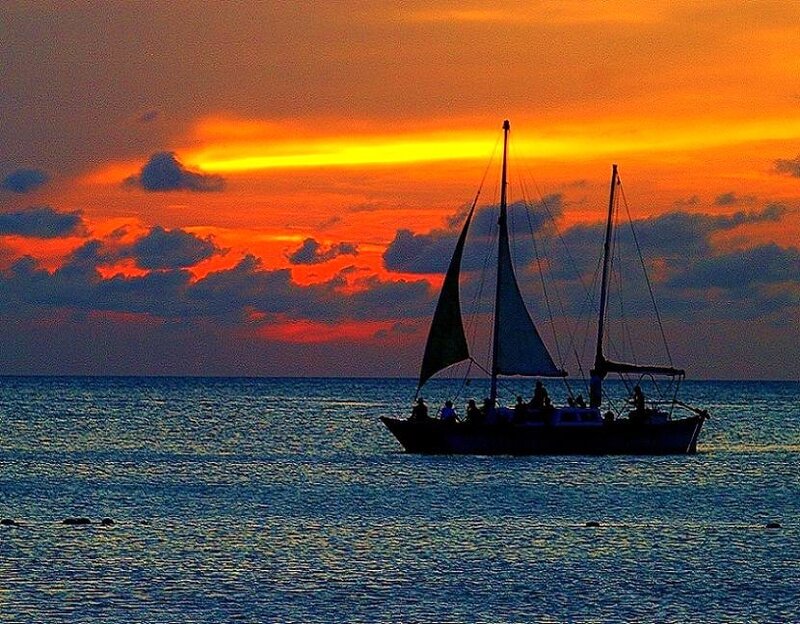 Sailboat at Sunset — Orange, Dramatic, Photograph, Ocean, Clouds, People