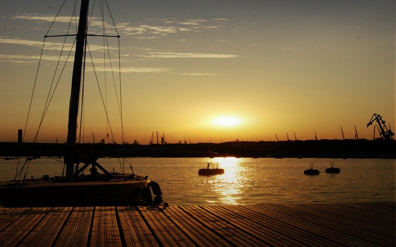 Sailboat at Sunset — Orange, Serene, Photograph, Dock, Cranes