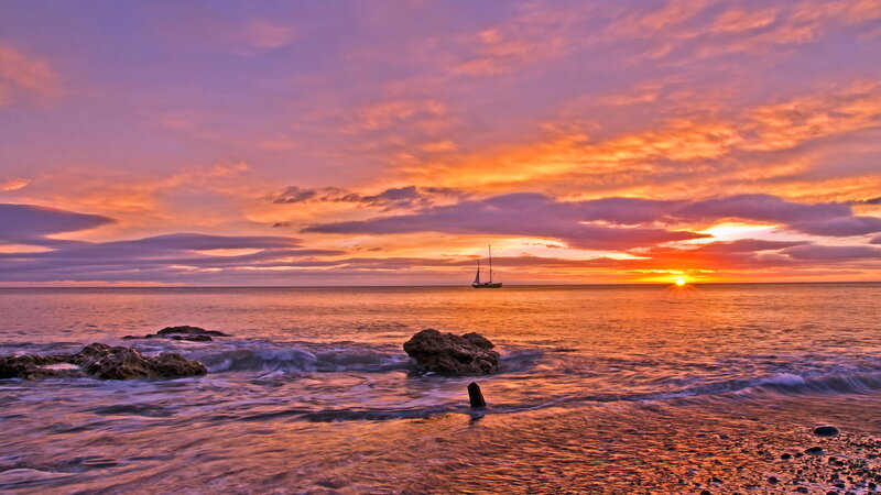 Sailboat at Sunset — Orange, Serene, Photograph, Ocean, Rocks, Clouds