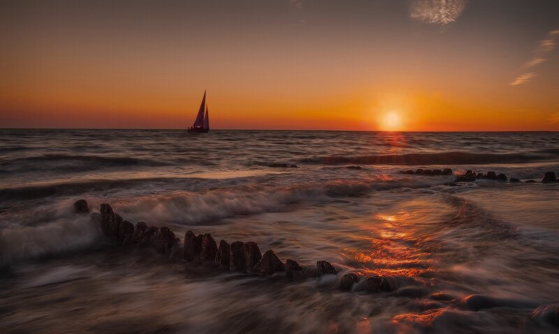 Sailboat at Sunset — Orange, Serene, Photograph, Ocean, Sun, Rocks