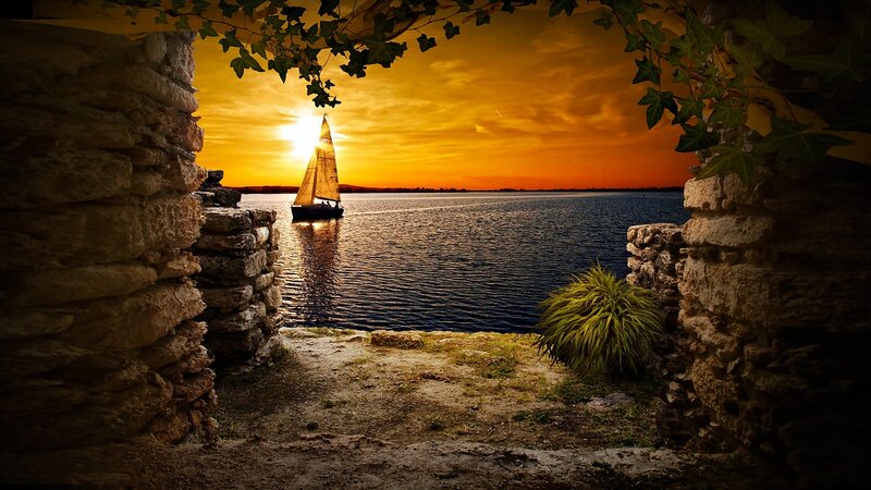 Sailboat at Sunset — Orange, Serene, Photograph, Stone Wall