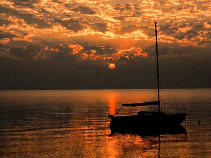 Sailboat at Sunset — Orange, Serene, Photograph, Sun, Clouds, Water, Black