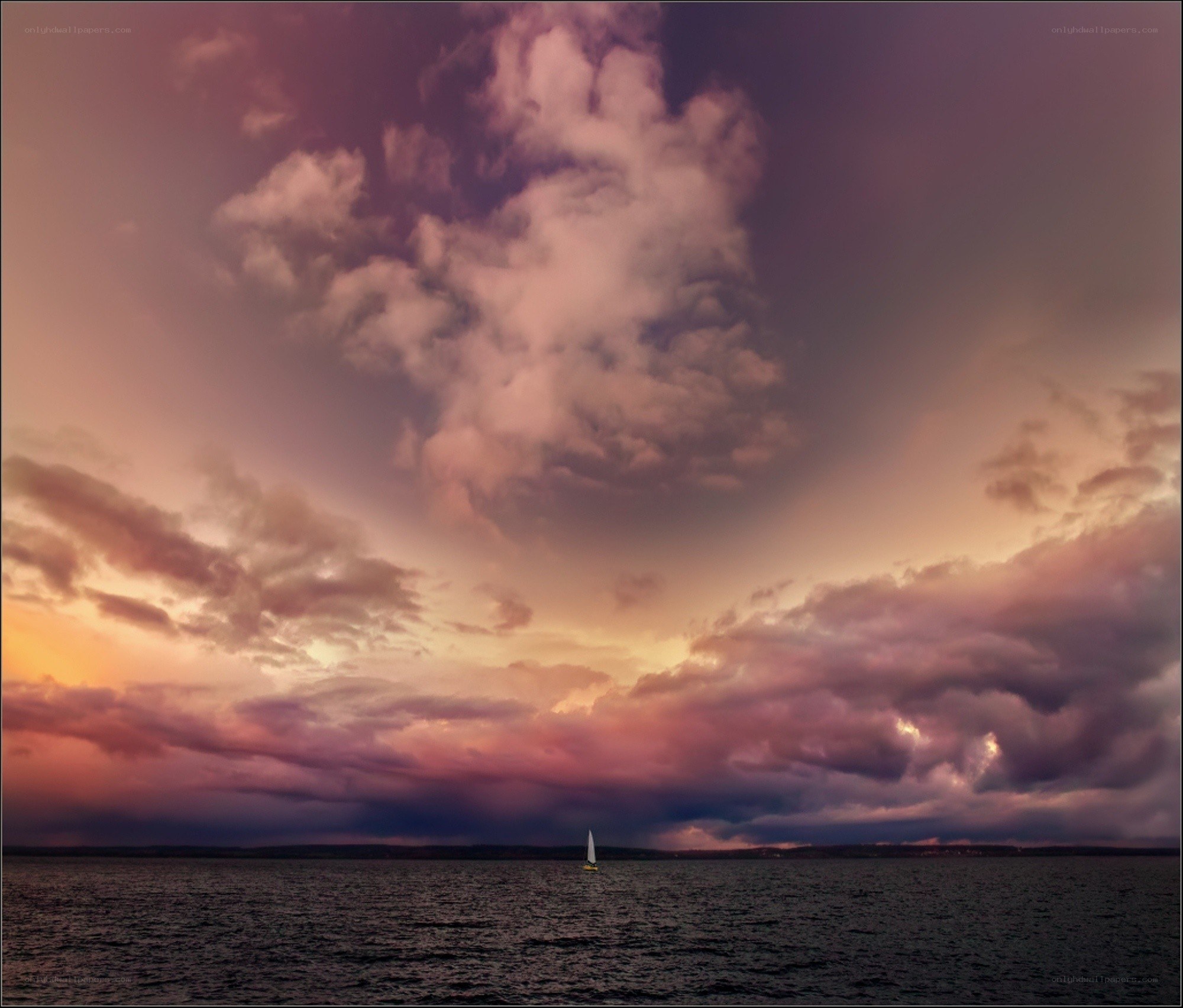 Sailboat at sunset over water