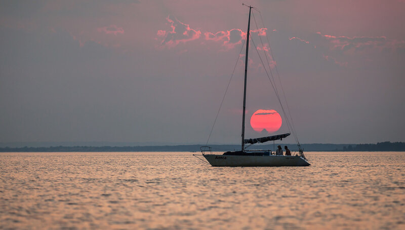 Sailboat at Sunset — Pink, Serene, Photograph, Sun, People