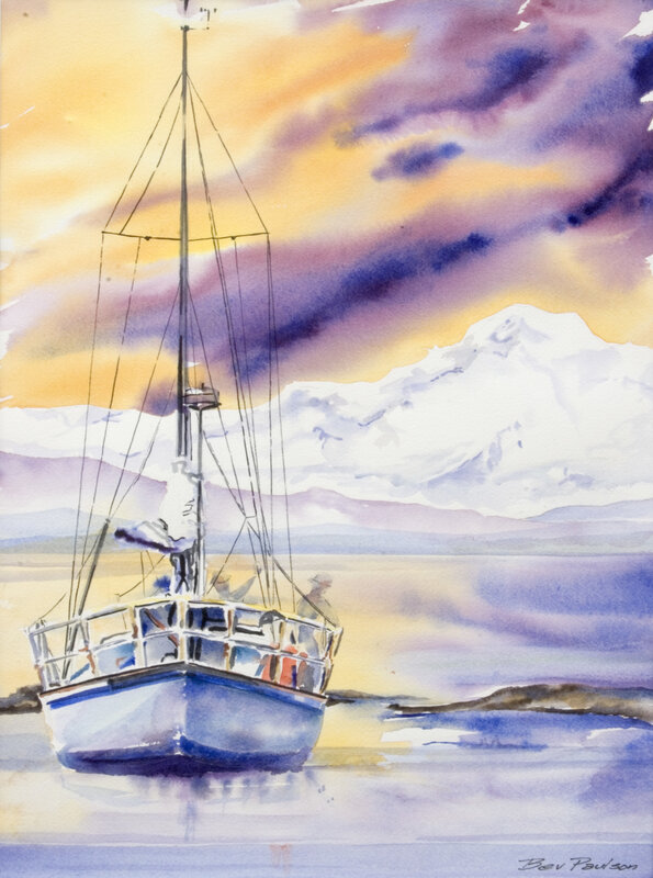 Sailboat at sunset with mountains