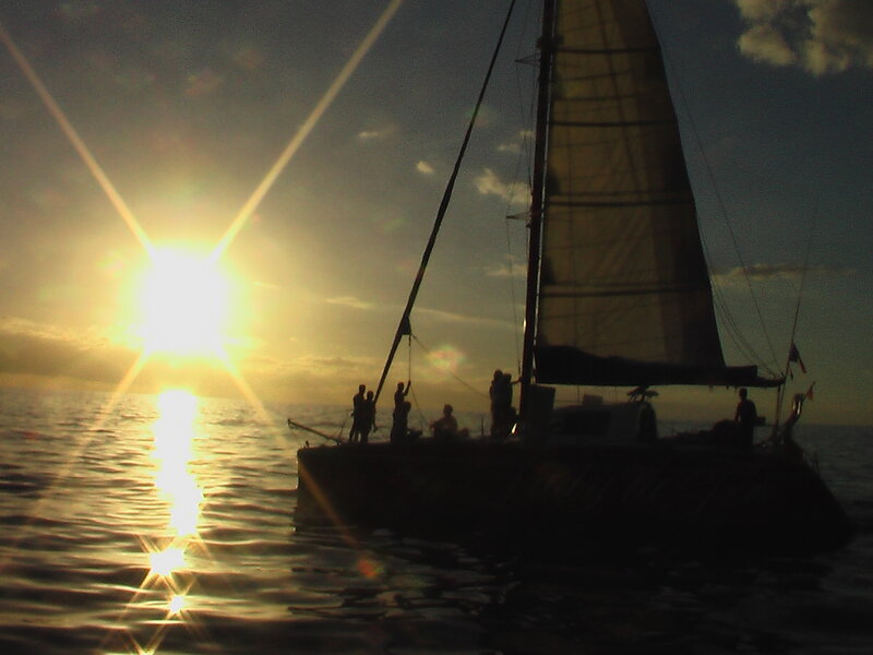 Sailboat at Sunset — Yellow, Serene, Photograph, People