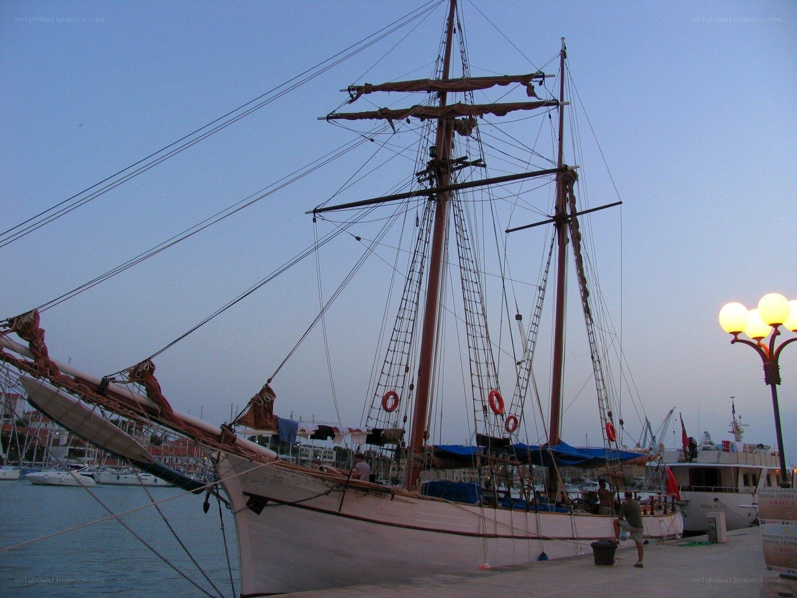 Sailboat docked at harbor