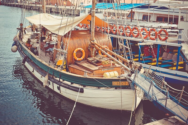 Sailboat docked at harbor