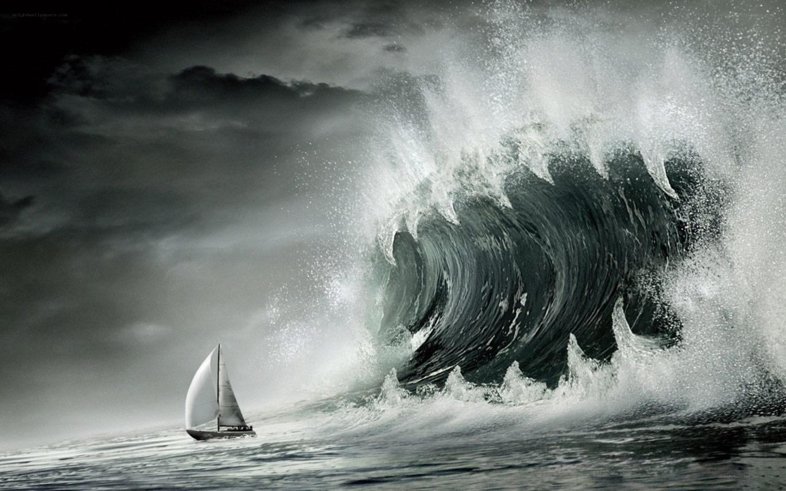 Sailboat facing a massive wave