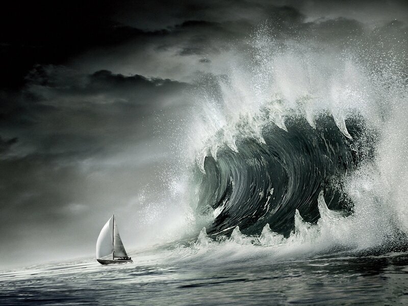 Sailboat facing a massive wave