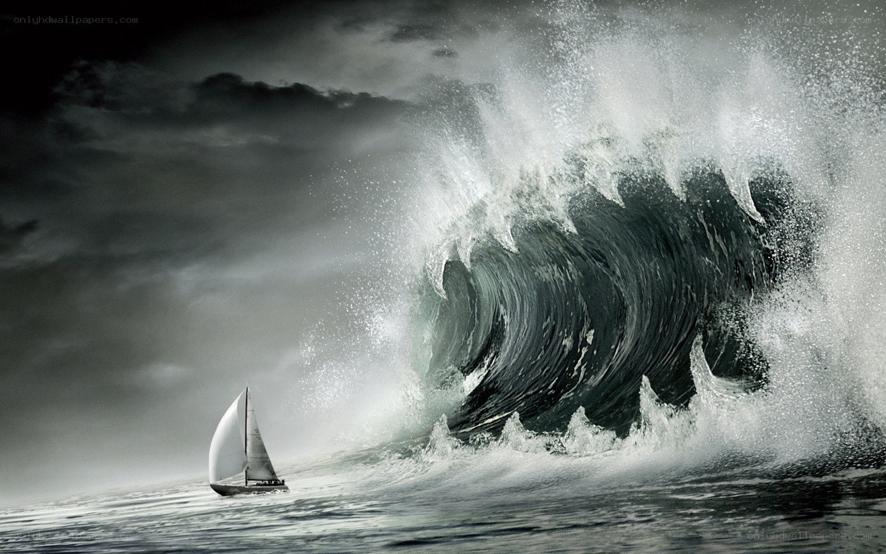 Sailboat facing massive wave