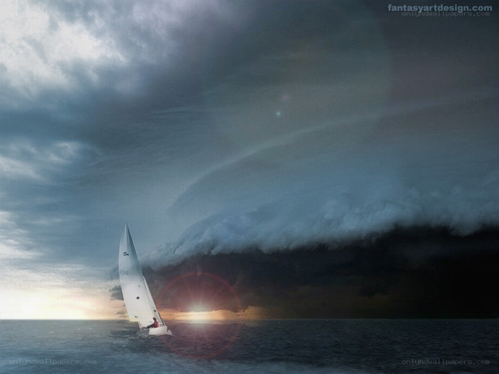 Sailboat facing storm at sunset
