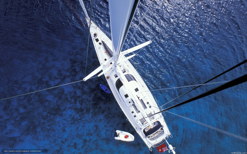 Sailboat from above on blue sea