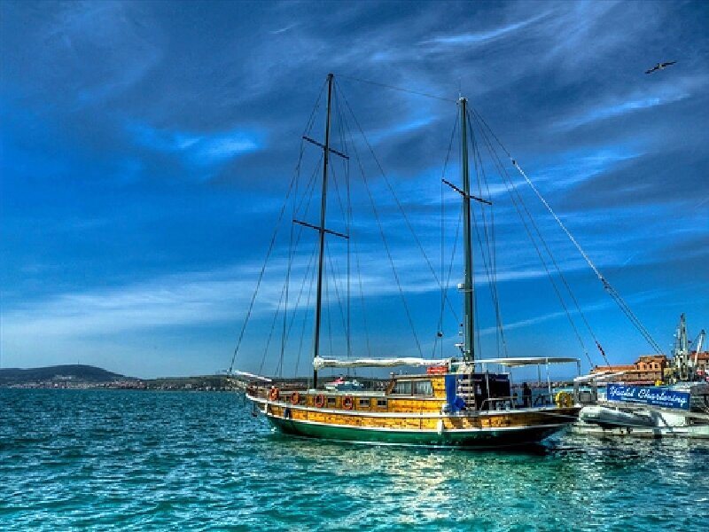 Sailboat in a blue harbor