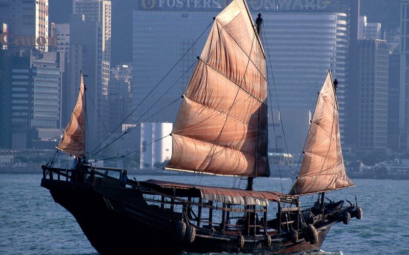 Sailboat in a city harbor