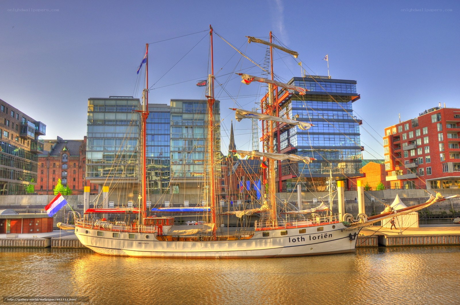 Sailboat in a city harbor