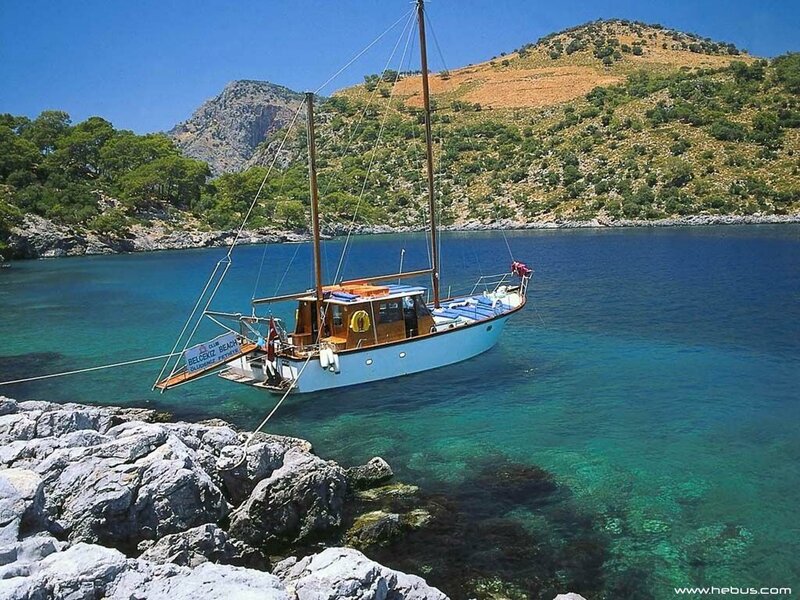 Sailboat in a turquoise cove