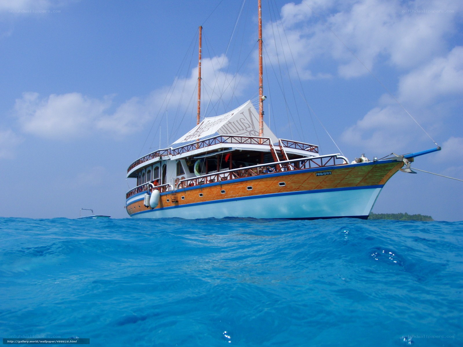 Sailboat in blue ocean