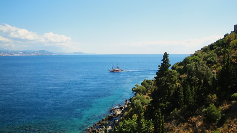 Sailboat in Blue Sea — Serene, Afternoon, Photograph, Trees