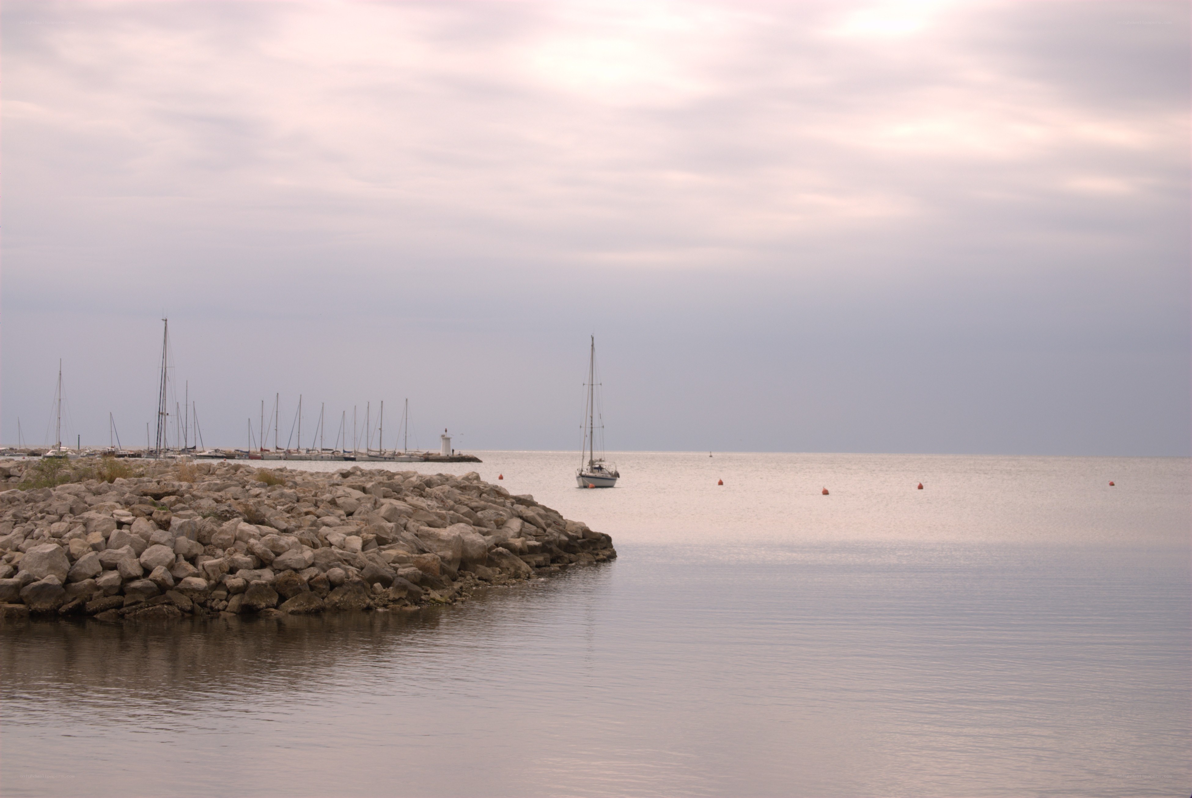 Sailboat in calm harbor