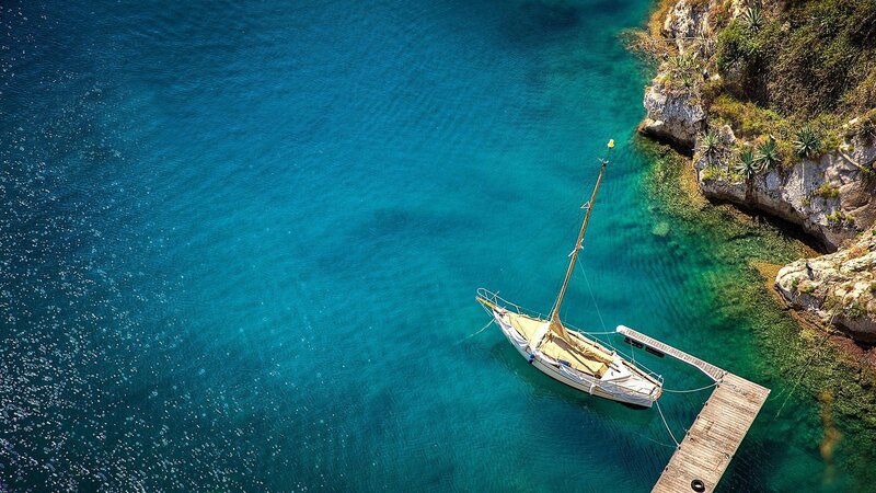 Sailboat in Cove — Blue, Serene, Afternoon