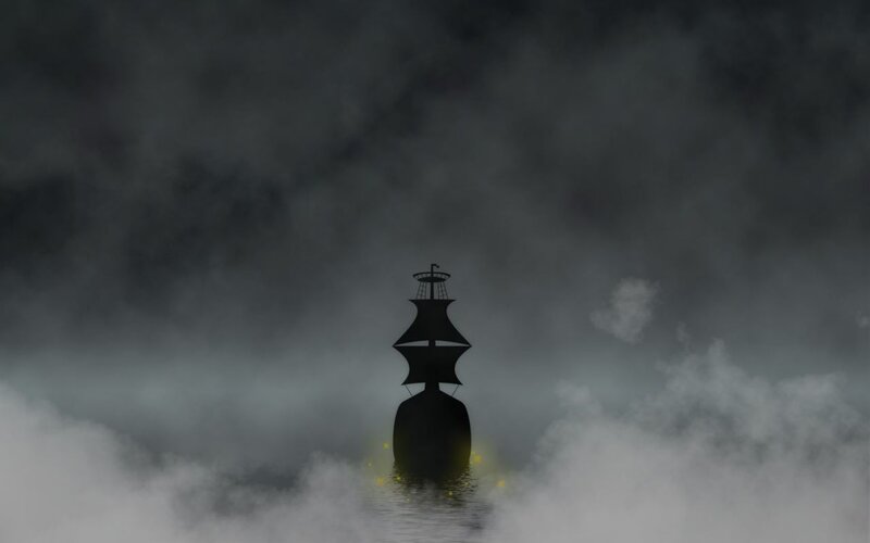 sailboat in foggy sea