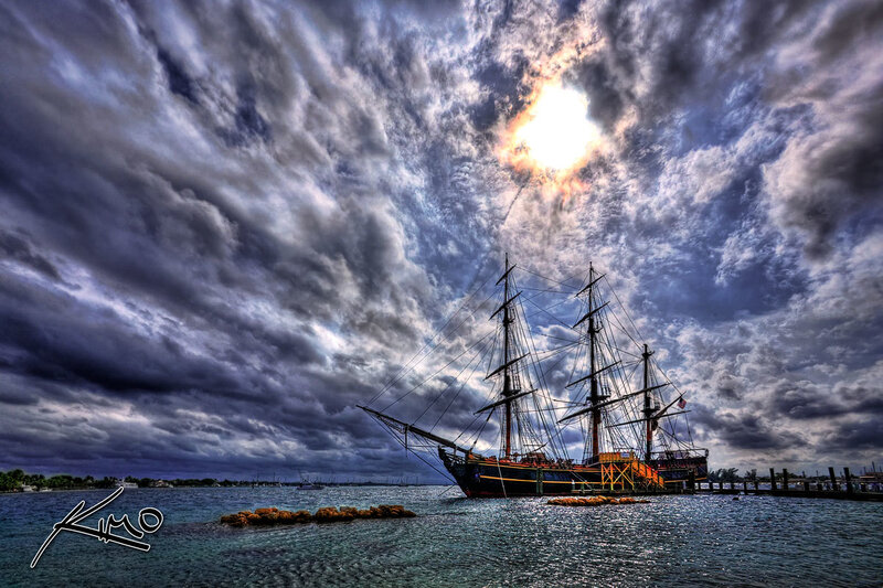 Sailboat in Harbor — Blue, Dramatic, Sunset, Photograph, Cloudy Sky