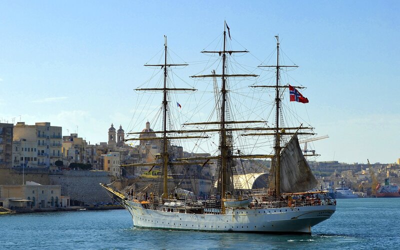 Sailboat in Harbor — Blue, Serene, Afternoon, Photograph, Cityscape, Flag