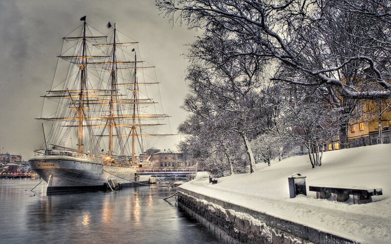 Sailboat in Snowy Harbor — White