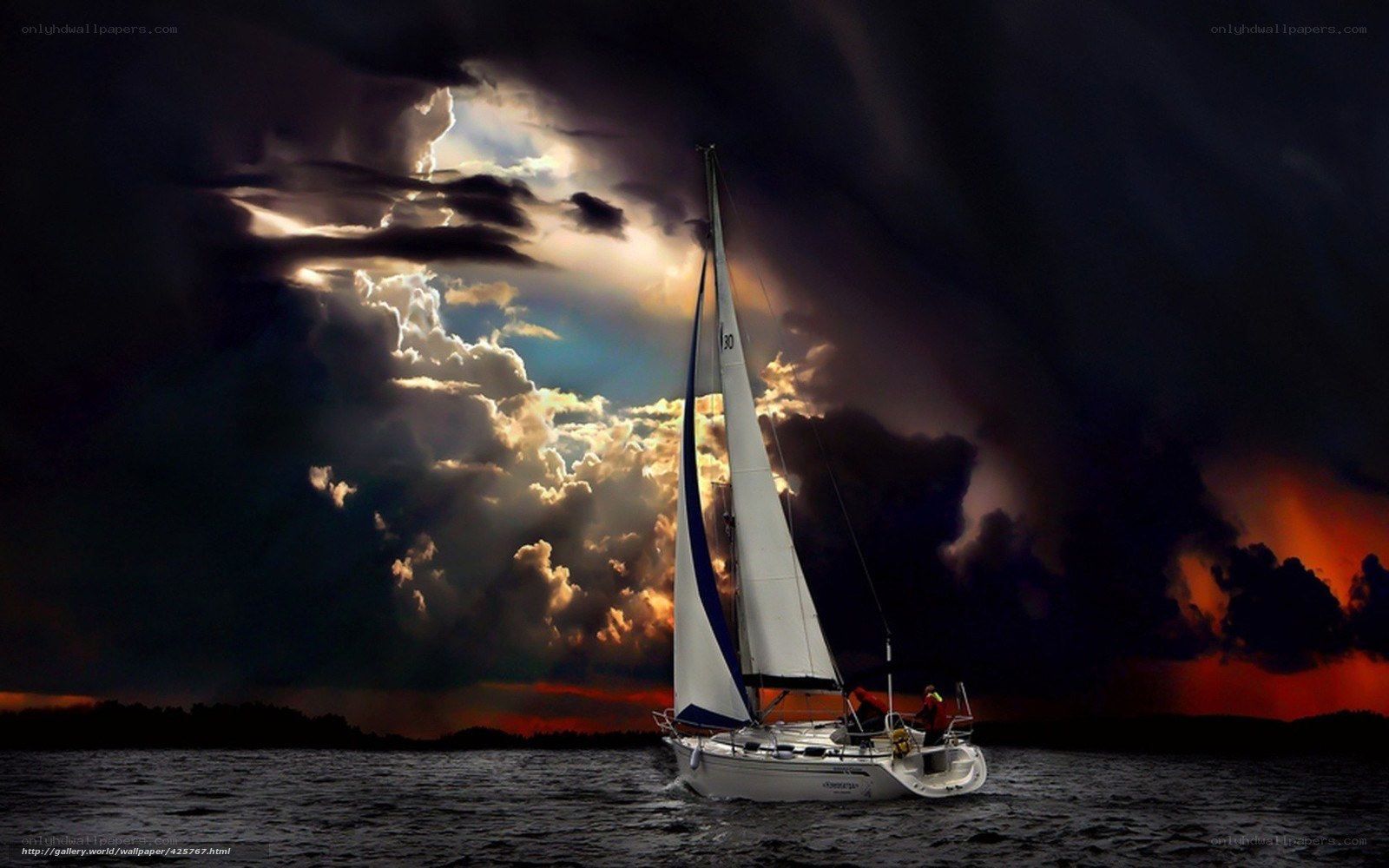Sailboat in stormy sunset
