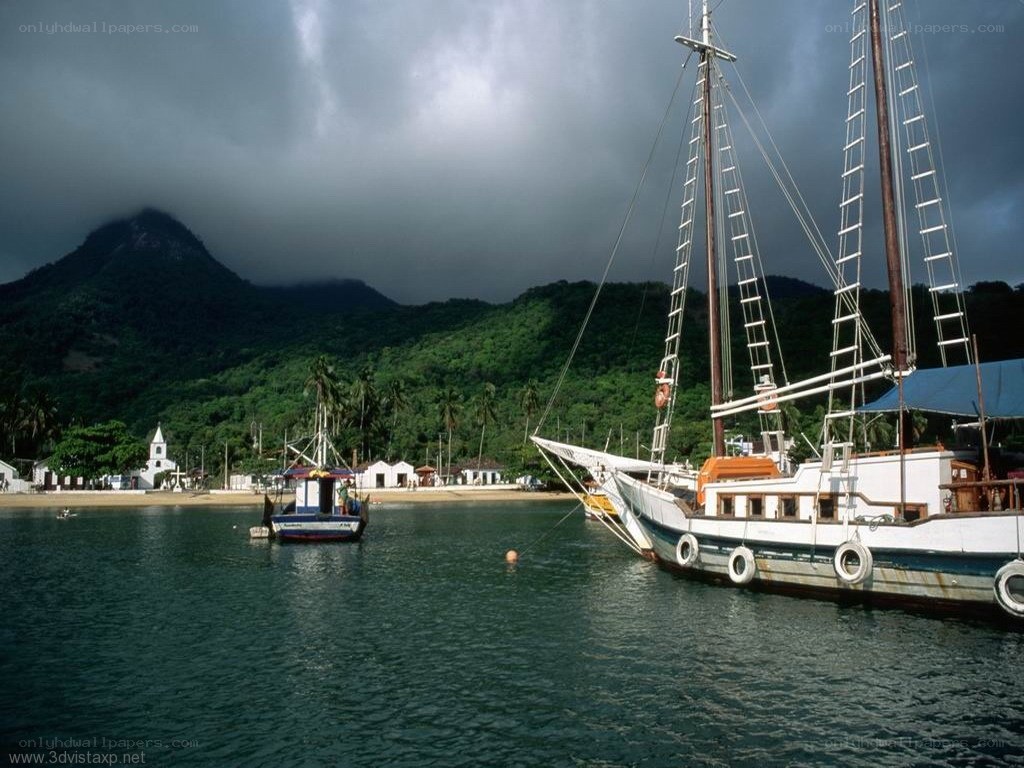 Sailboat in tropical harbor