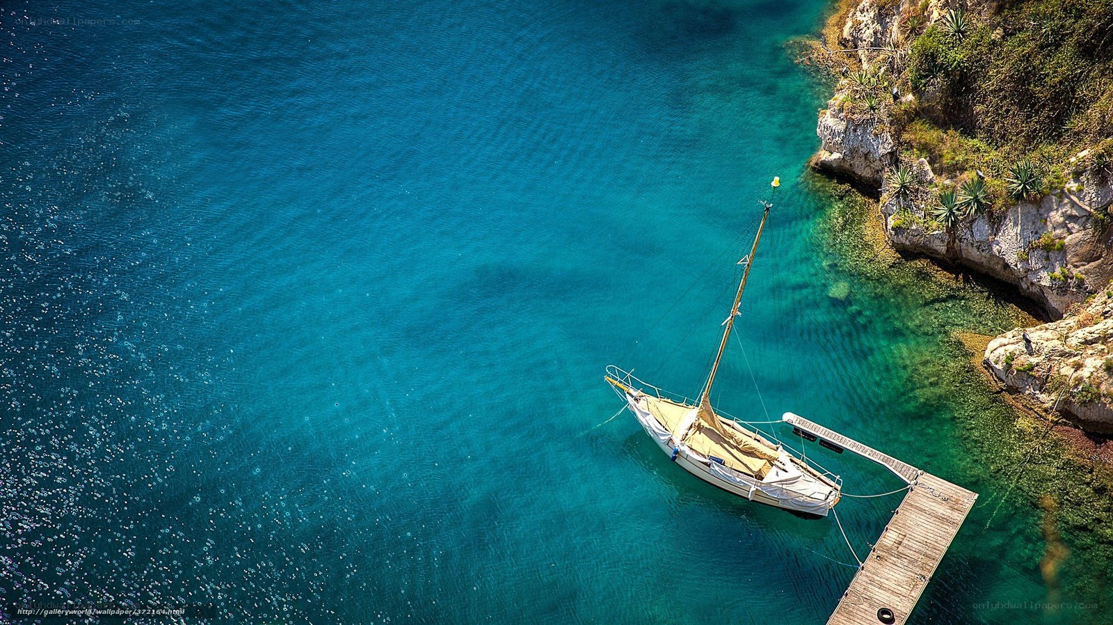 Sailboat in turquoise cove