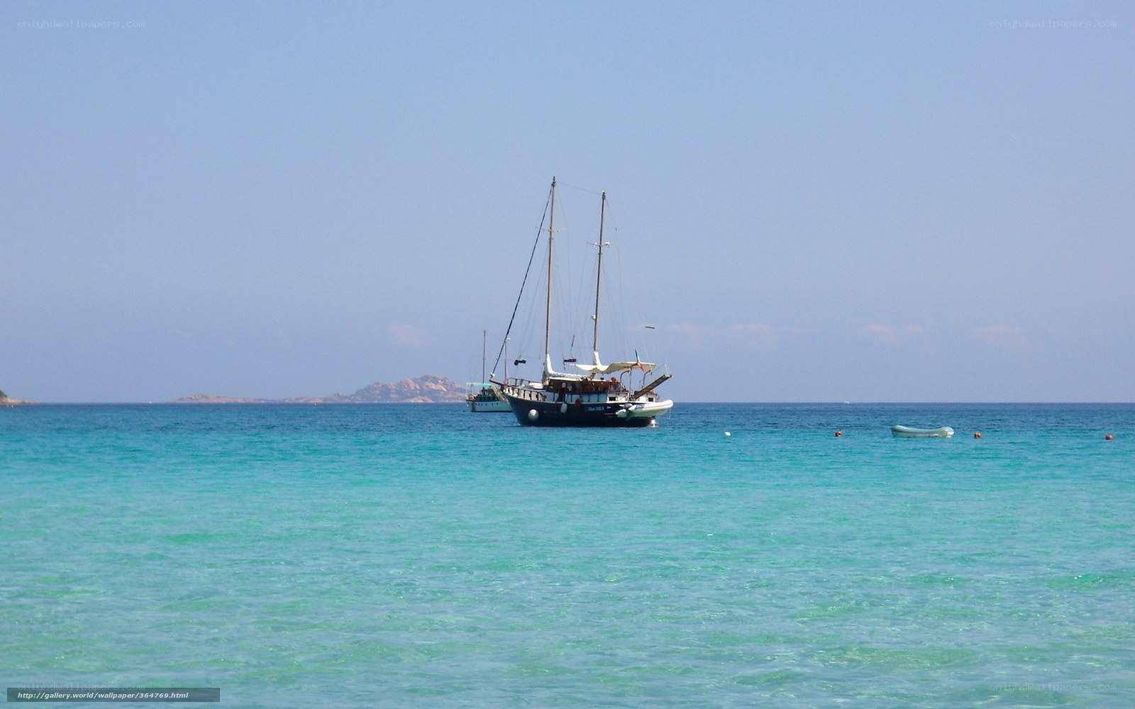Sailboat in turquoise sea