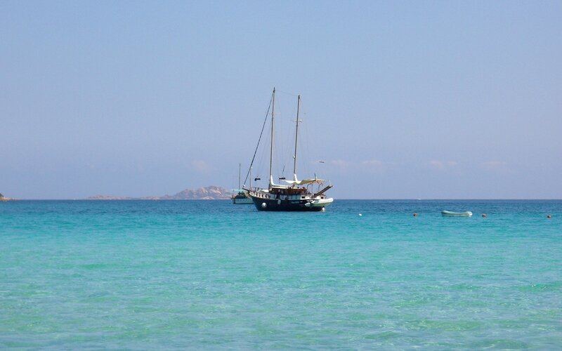 Sailboat in turquoise water