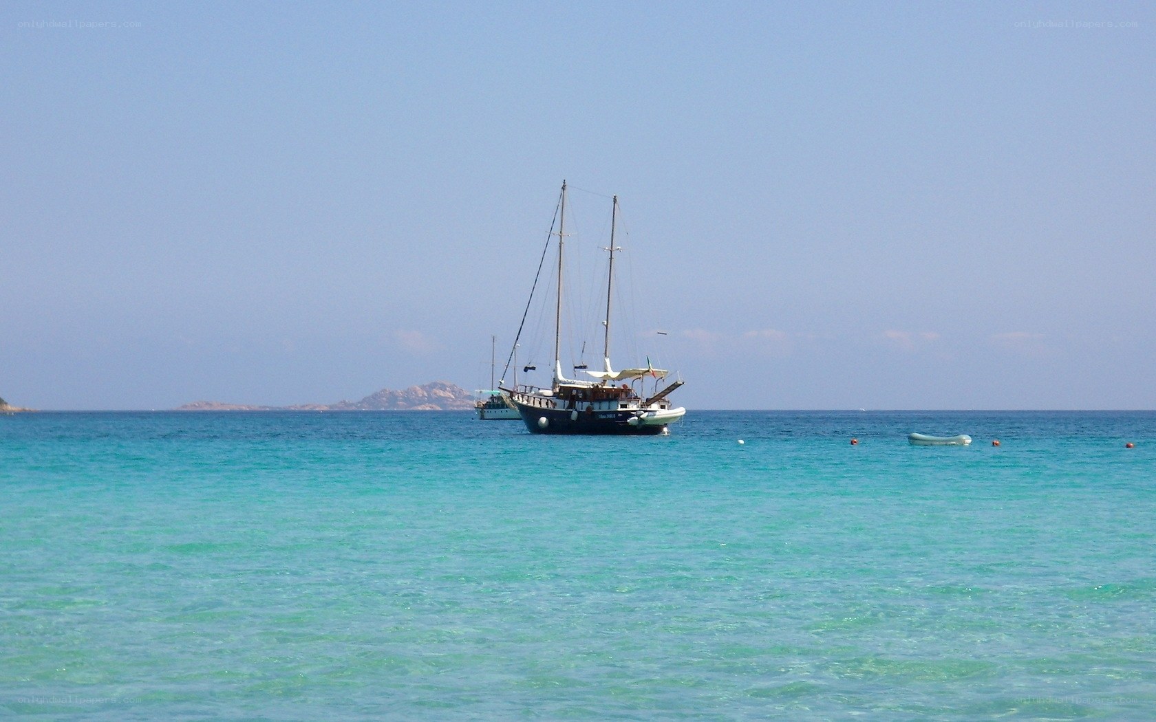 Sailboat in turquoise waters