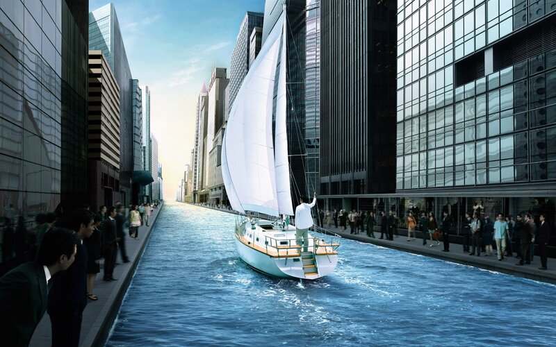 Sailboat in urban canal