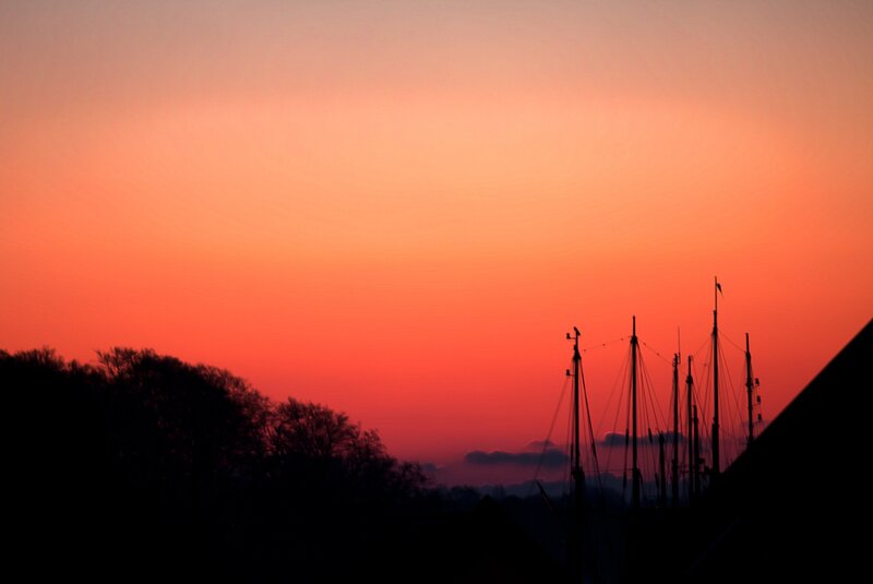 Sailboat Masts at Sunset — Orange, Serene