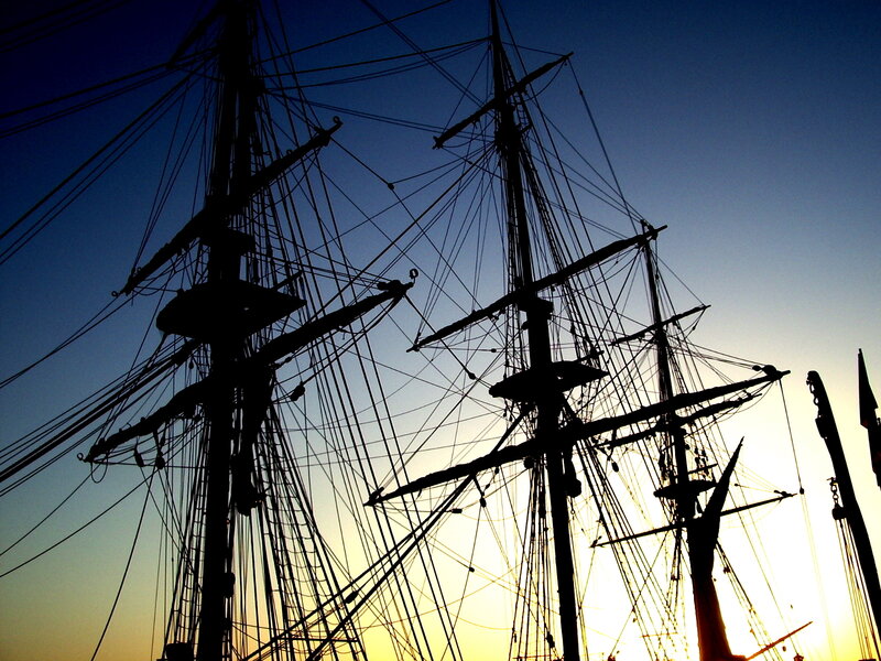 sailboat masts at sunset