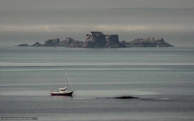 Sailboat near a coastal fortress