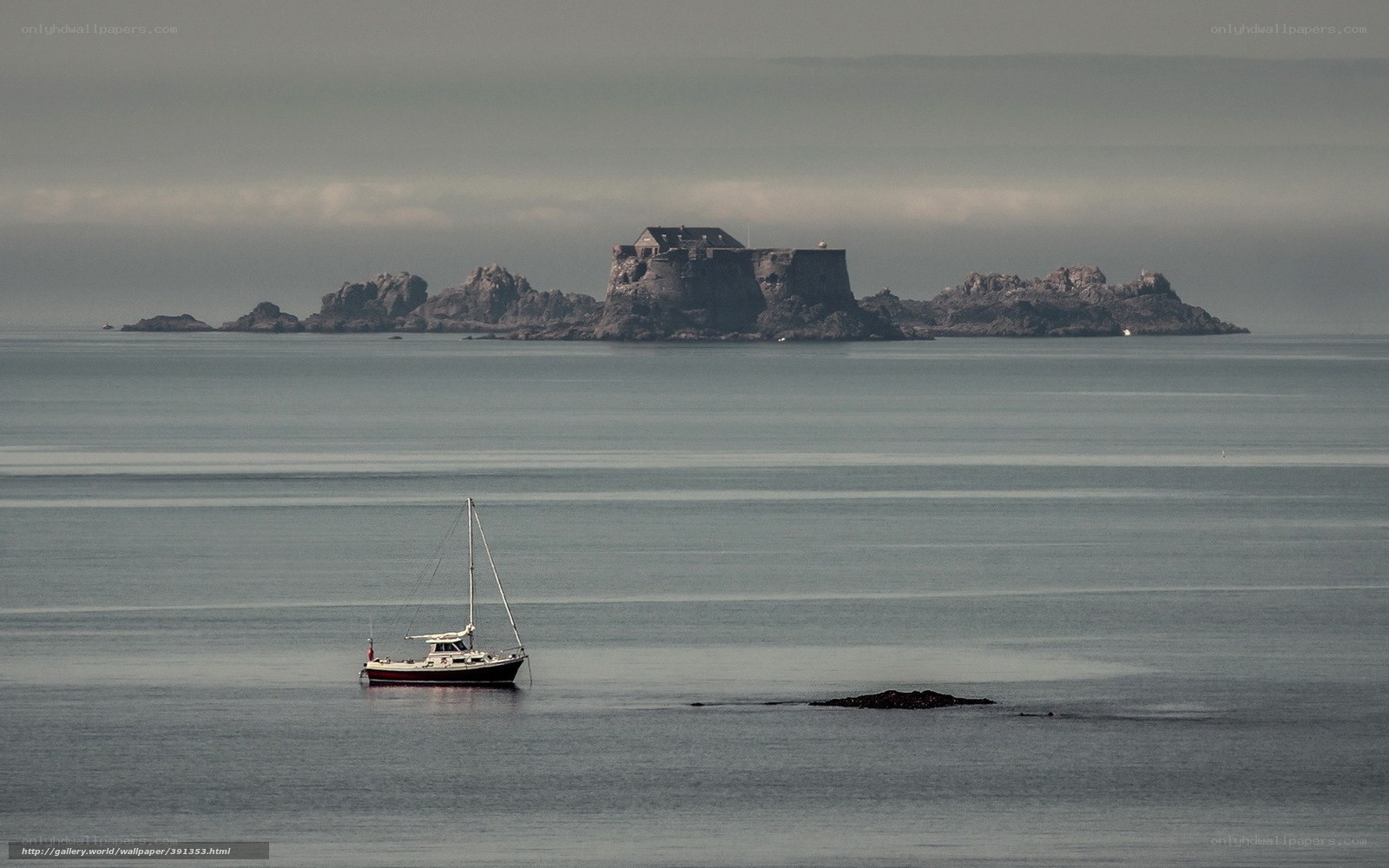 Sailboat near a coastal fortress