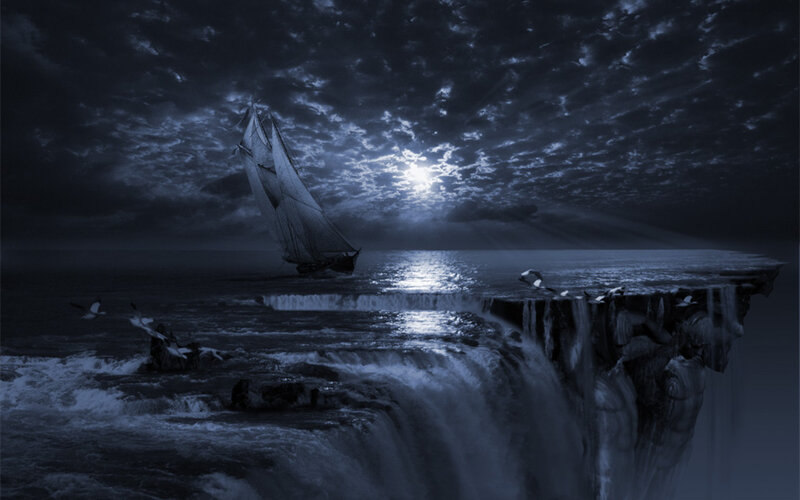 Sailboat near a waterfall at night
