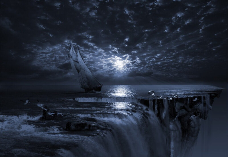 Sailboat near a waterfall cliff